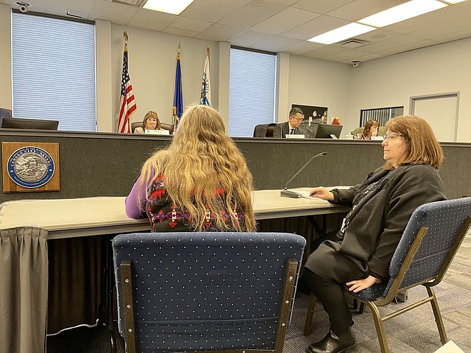 Dee Dee Foremaster of Rural Center for Independent Living, left, and Mirjana Gavric, Carson City grants administrator, discuss funding and homelessness at Thursday’s supervisors meeting.
