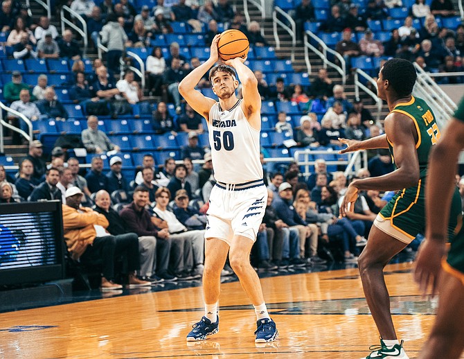 Wolf Pack center Will Baker, shown in a game earlier this season, posted numerous career highs in Nevada’s double-overtime win over New Mexico.
