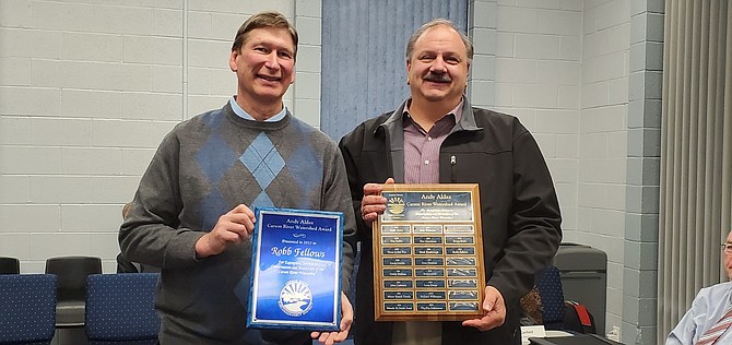 Robb Fellows receiving the Andy Aldax Carson River Watershed Award with CWSD Board Chair Stacey Giomi on Jan. 18.