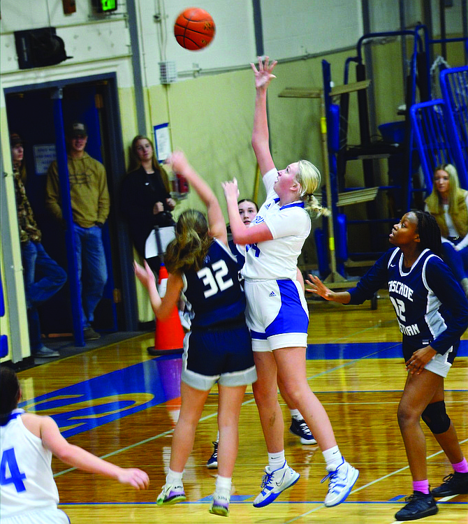 Eatonville’s Lillian Bickford scores over a defender in a game earlier in the season. Bickford scored a career-high 16 points in the Cruisers’ 53-31 win over Elma on Jan.17.