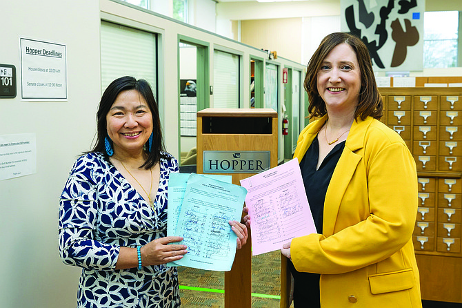 Washington Rep. My-Linh Thai, D-Bellevue, and Sen. Noel Frame, D-Seattle, stand next to the respective wealth tax bills they submitted to the state Legislature hopper for consideration last week in Olympia.
