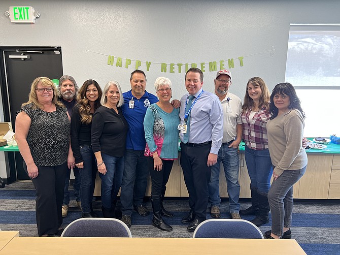 Carson City School District Operations staff members and Superintendent Andrew Feuling, fourth from right, celebrate the retirement of director Mark Korinek, fifth from left, after about 25 years overseeing construction management and facilities.