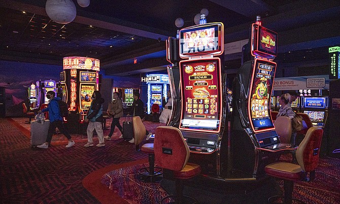 People walk along the slot floor of the Mohegan Casino Las Vegas on Jan. 29, 2023.
