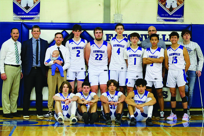 The 2022-23 Eatonville boys basketball team poses for a photo following the Cruisers’ Evergreen Conference title-clinching win over Tenino on Jan. 26.