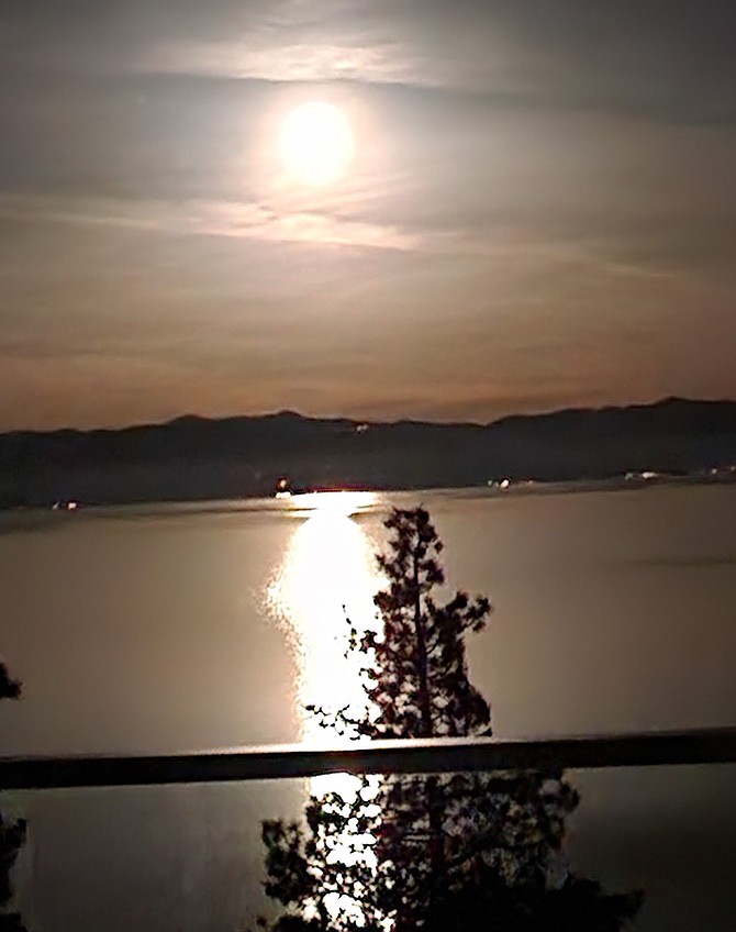 Cave Rock resident June Shafer took this photo of the moon reflected in Lake Tahoe on Thursday morning.