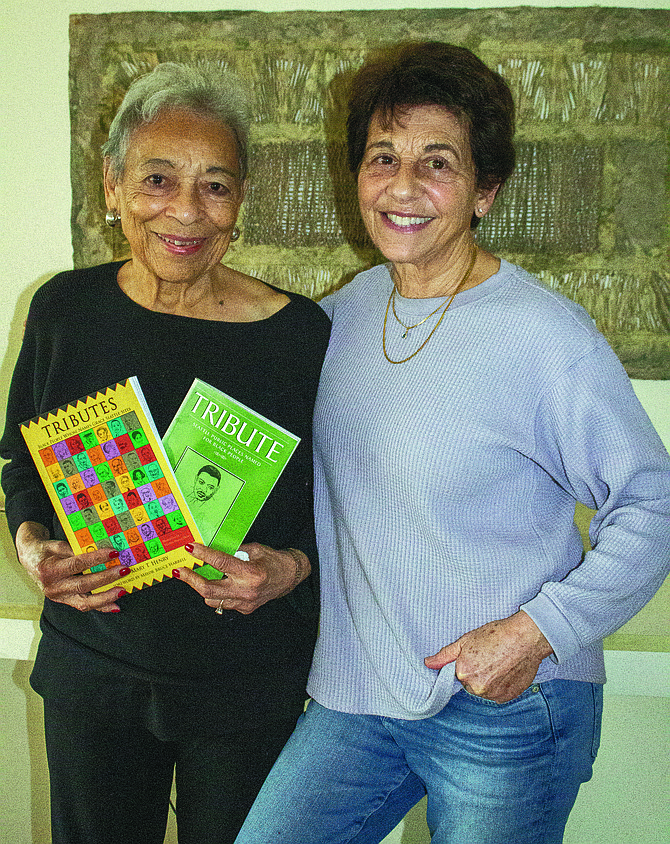 Madison Park resident and author Mary Henry, left, and her daughter-in-law and illustrator Marilyn Hasson Henry stand with Mary Henry’s recently released book, ‘Tributes: Black People Whose Names Grace Seattle Sites.'