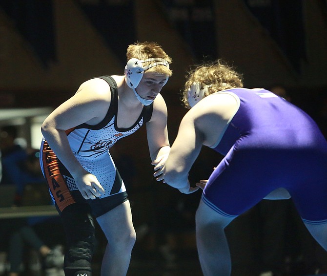 Douglas High’s Sage Adie sizes up his opponent in the Class 5A North 215-pound finals at Carson High on Saturday. Adie took second place in the regional tournament with two wins coming via the pin in order to advance to the 2023 Class 5A state wrestling tournament this Saturday in Winnemucca.