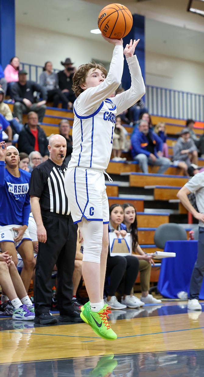 Carson’s Ethan Grant shoots for three during the game between the Galena Grizzlies and the Carson High Senators Monday.