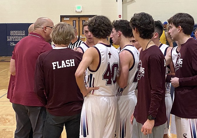 Sierra Lutheran talks things over during a second-half timeout Wednesday. The Falcons went on to beat Coleville in the first round of the 1A West playoffs.