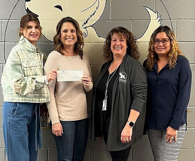 New Millennium Building Systems of Fallon presented a check to Lahontan Elementary School for more than $11,000. From left are Heidi McAlexander, New Millennium; Jen Buckmaster, LES teacher; Kimi Melendy, LES principal; and Tiffany Morris, New Millennium.