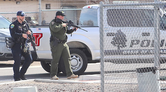 Officers from the Fallon Police Department and the Churchill County Sheriff’s Office check Churchill County High School’s perimeter during a lockdown last week.