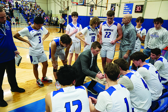 Eatonville head coach TJ Cotterill goes over a play during a timeout in the Cruisers’ game against Elma on Feb. 14. The Cruisers fell to both Elma and La Center last week to end their season.