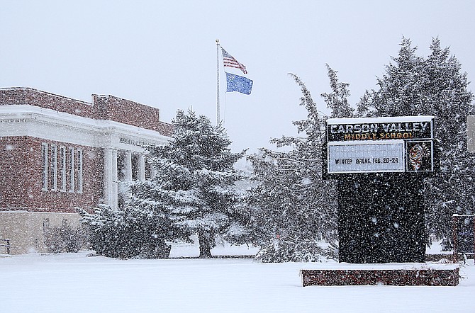 Winter break indeed. Flags indicate a north wind bringing heavy snow to Gardnerville on Friday morning.