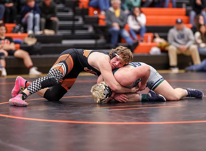 Douglas High’s Aaron Tekansik looks to turn his opponent from Damonte Ranch, during a dual meet earlier this season. Tekansik picked up a first team all-region selection at 190 pounds this winter to cap his junior season.