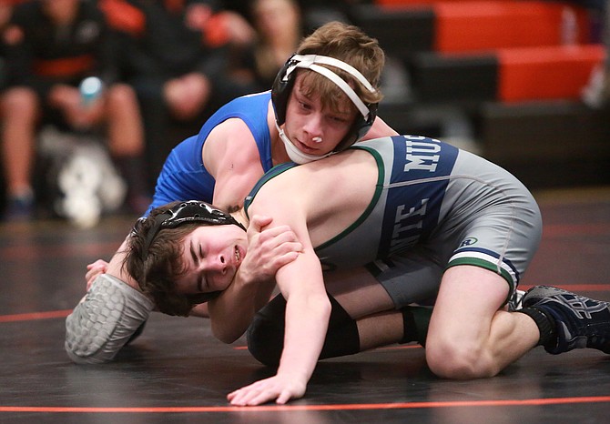Carson High’s Jesse Oliva works against a Damonte Ranch wrestler in late January. Olivia earned a second team all-region selection for his performance on the mat this winter.