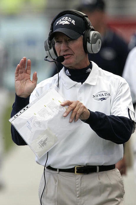 Nevada football coach Chris Ault leads the Wolf Pack against Hawaii in 2005.