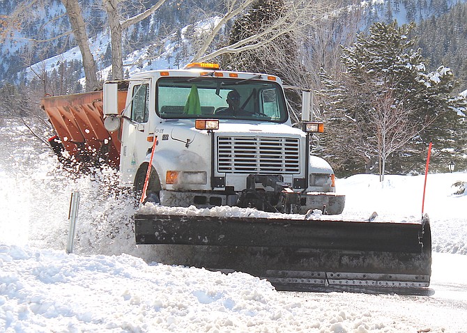 A Douglas County snowplow touches up the edges of Jacks Valley Road on Wednesday afternoon.