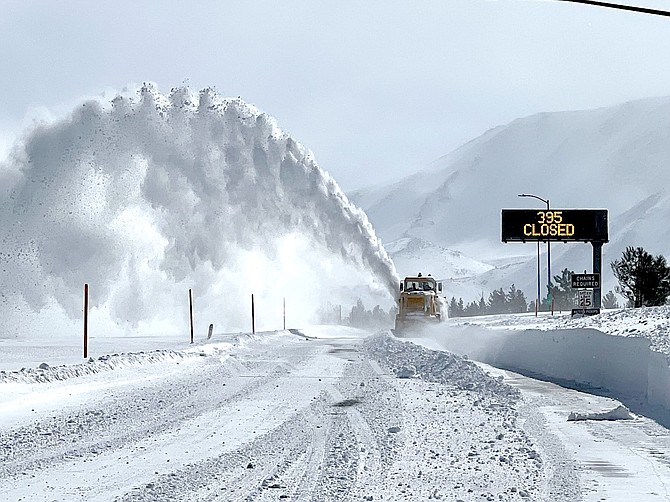 A California Department of Transportation snowplow works on Highway 395 in Mono County.