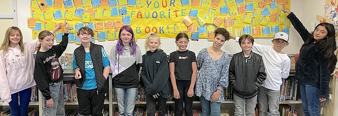 Numa's Student Council in front of the board in the library where Numa students shared their favorite books. Pictured from left are Peyton Gray Bryant, Vivian Gomes, Adrienne Gerrard, Melody Plank, Ashlyn Johnson, Alieya Molina, Sarah Peterson, Ayhdyn Docherty, Darius Fruzza and Yanis Barajas.