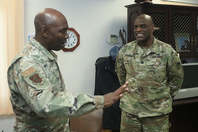Nevada Adjutant General Maj. Gen. Ondra Berry, left, and Lt. Col. Brian Fiddermon, garrison commander of the Army Support Activity Black Sea, discuss the mission of the 137th Military Police Co., Nevada Army National Guard at the Mihail Kogalniceanu Air Base, Romania.