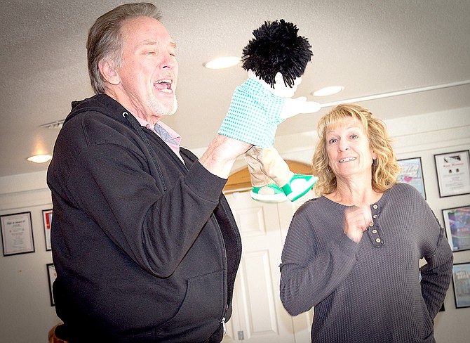 Tim Pepper portrays Dewey Davenport with his puppet Obediah along with Susan Squires, who plays Peaches Verdeen Belrose.