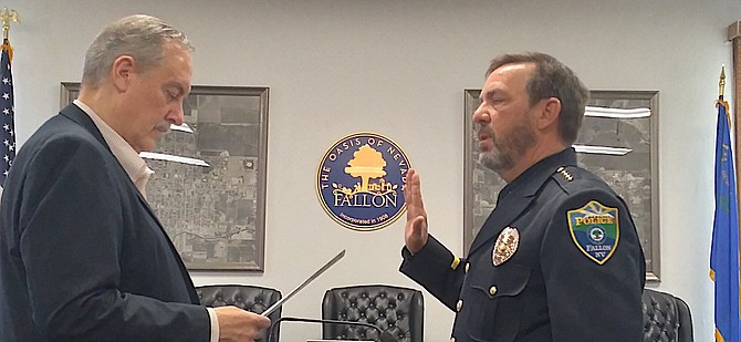 Mayor Ken Tedford, left, swears in Capt. Ron Wenger as the Fallon Police Department’s new chief.
