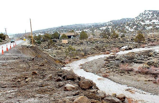 Pine Nut Creek took a bite out of the slope below Fish Springs Road during the March 10 storm.