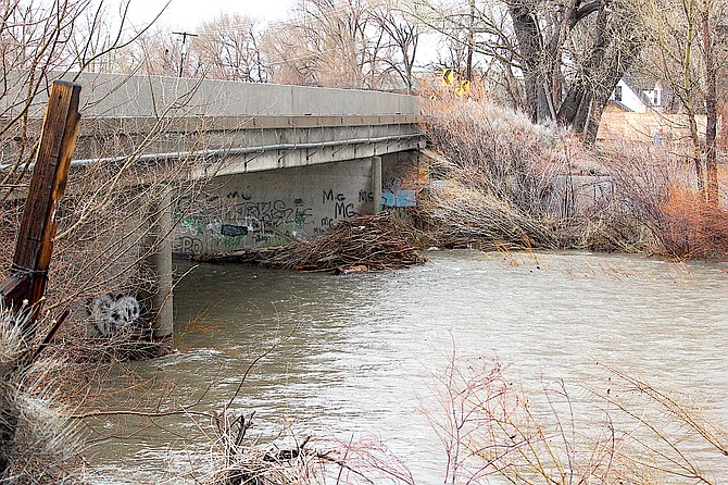 The East Fork of the Carson River was still running below the first level of graffiti in Gardnerville on Tuesday. Nevada Department of Transportation  inspectors were out checking  the bridges.
