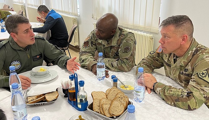Romanian Air Force (colonel) Nicolae Cretu, left, discusses his country’s training with Nevada National Guard Adjutant General Maj. Gen. Ondra Berry, center, and Brig. Gen. Troy Armstrong, Land Component commander for the Nevada Army National Guard.