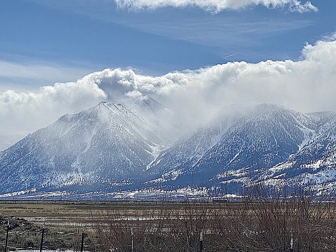 Clouds crest the Sierra on Monday. Photo special to The R-C by Katherine Replogle.