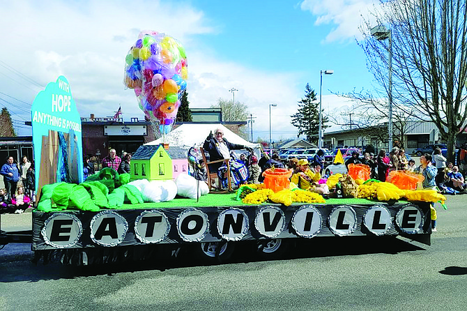A volunteer rides Eatonville’s float at a previous Daffodil Festival parade. Coordinators Sarah and Brad Cole had intended to step down this year but have opted to stay on so the community can have a float to enter. They are looking for volunteers to help build this year’s float, as well as seeking new coordinators for 2024.