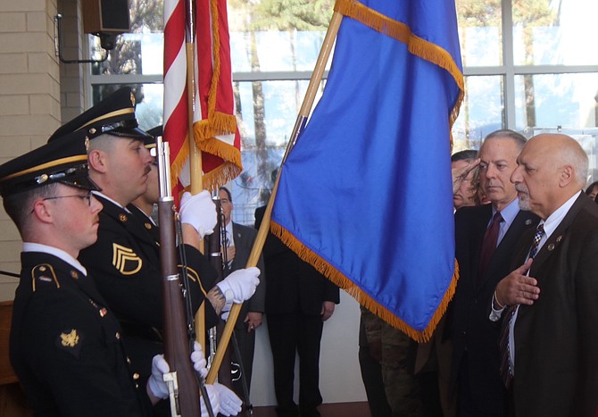 Gov. Joe Lombardo, second from right, and Lt. Gov. Stavros Anthony recite the Pledge of Allegiance before the Nevada Army National Guard color guard during Veterans and Military Day at the Legislature on March 15, 2023.