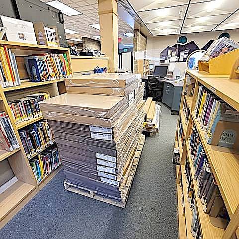 Pallets of flooring await installation inside the Minden Branch of the Douglas County Public Library.