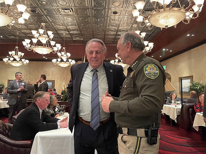 Nevada Gov. Joe Lombardo talks with Carson City Sheriff Ken Furlong at Casino Fandango on Monday.