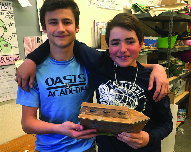 Austin Steffens, left, and Tyler Crystal pose with their model ironclad.