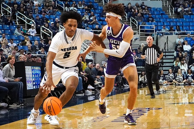 Nevada’s Darrion Williams dribbles against Grand Canyon’s Walter Ellis on Nov. 12, 2022 in Reno.