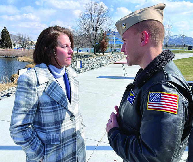 U.S. Sen. Catherine Cortez Masto and Capt. Shane Tanner, commander of Naval Air Station Fallon, have a conversation after Remembrance Day.