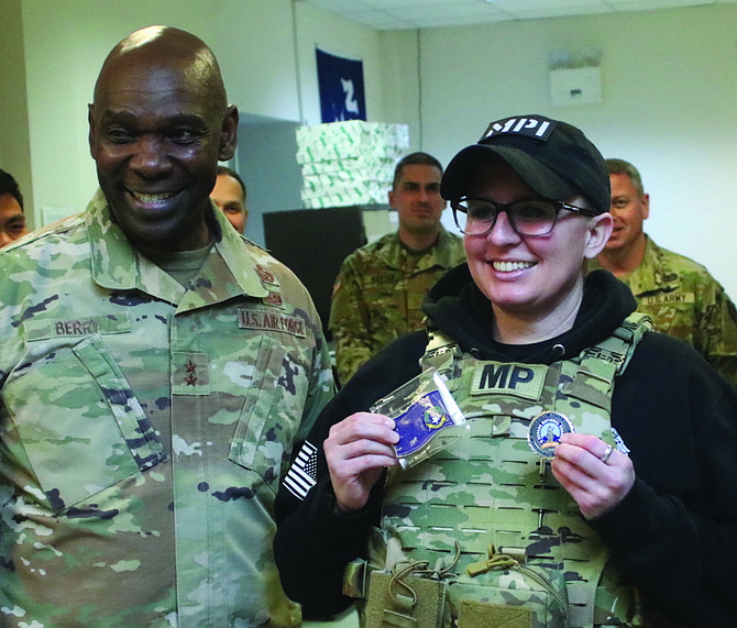 Sgt. First Class Tamara Polson, right, was presented with a Nevada flag and challenge coin by Maj. Gen. Ondra Berry, Nevada’s adjutant general.