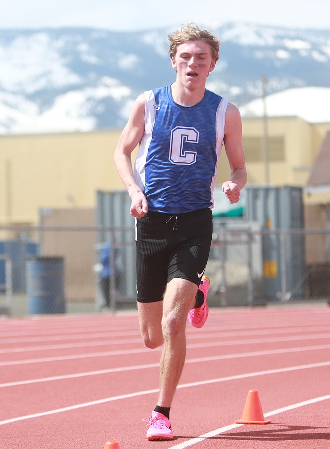 Sawyer Macy leads the charge during the 3,200-meter run at the Carson High league meet Saturday. Macy won the 1,600 and 3,200 meter runs.