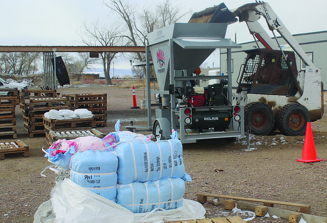 The Churchill County Road Department fills sandbags Monday morning at its Miners Road location.