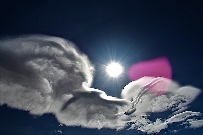 The full moon illuminates an odd cloud in this photo taken by Tim Berube.