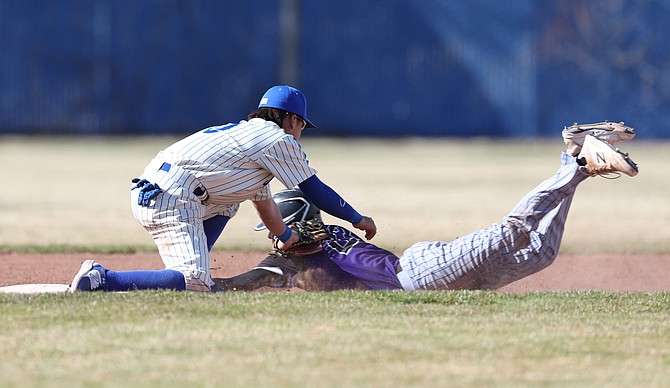 Carson shortstop Jeremy Hernandez tags Spanish Springs runner Beau Shaffer during a March 30 game.