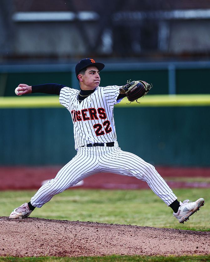 Douglas High sophomore Duncan De Lange deals a pitch Wednesday afternoon against Reed. De Lange threw five innings and struck out six batters while allowing just one run.