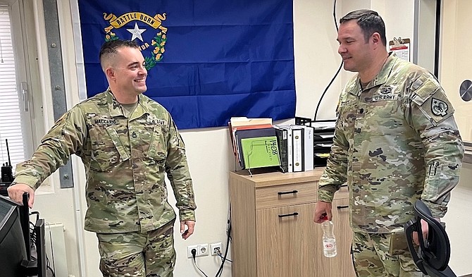 Sgt. 1st Class Kristopher Maccario, left, talks with his battalion commander, Lt. Col. Curtis Kolvet. The 137th Military Police Co., Nevada Army National Guard has been deployed to Romania since summer.