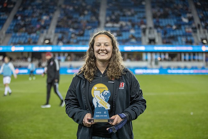 Cal State East Bay goalkeeper and Douglas High alumna Jordan Smith poses at midfield at the San Jose Earthquakes game Saturday, March 25. Smith was honored with the CalHope Courage Award for February 2023, presented by the College Sports Communicators and the Associated Press.