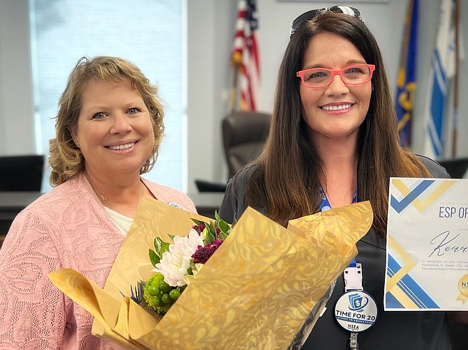 Nevada State Education Association President Dawn Etcheverry stands with Carson City School District’s Pioneer Academy school nurse/clinical aide Kerri Finn, who was honored Tuesday as Nevada’s statewide Education Support Professional Employee of the Year.