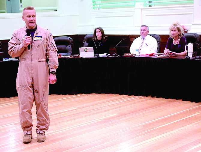 Capt. Shane Tanner, commanding officer at Naval Air Station Fallon, addresses the school board on April 12 about the Month of the Military Child.
