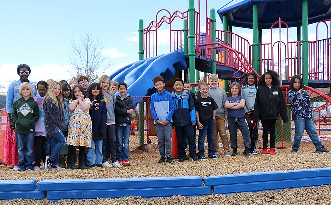 Fritsch Elementary School teacher Rachael Overstreet’s fourth grade class stands outside the school’s play structure, which has been fenced off to protect the goose that is nesting with its eggs until they hatch and she removes herself with them.