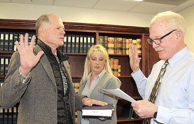 Tahoe Township Justice of the Peace Richard Glasson takes the oath of office administered by outgoing East Fork Justice of the Peace Tom Perkins on Jan. 4, 2019.