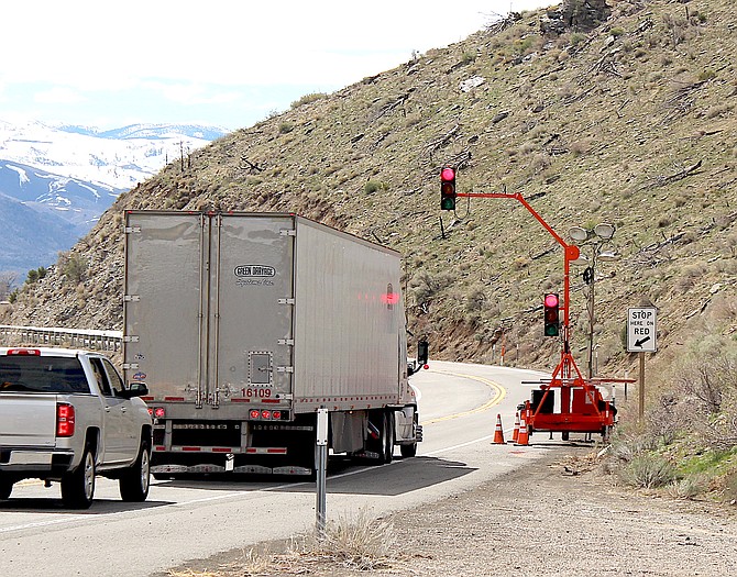 Vehicles wait for the light to turn green on Highway 395 above Topaz Lake on Friday morning.